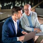 Business People Having Meeting In Modern Office In JHHWL8D 2 150x150