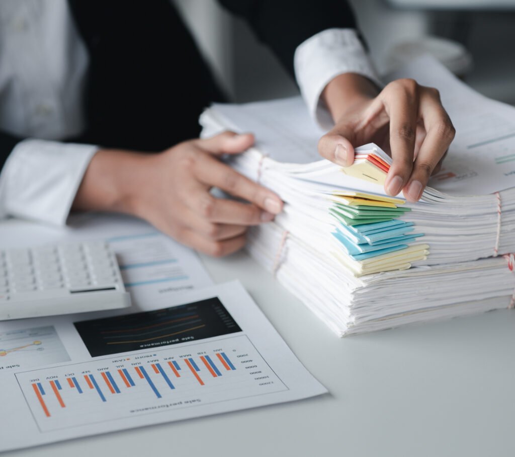 How Bookkeeping Impacts Business Growth Businessman Looking Through Stacks Of Papers On De RRG587R 1 1024x908