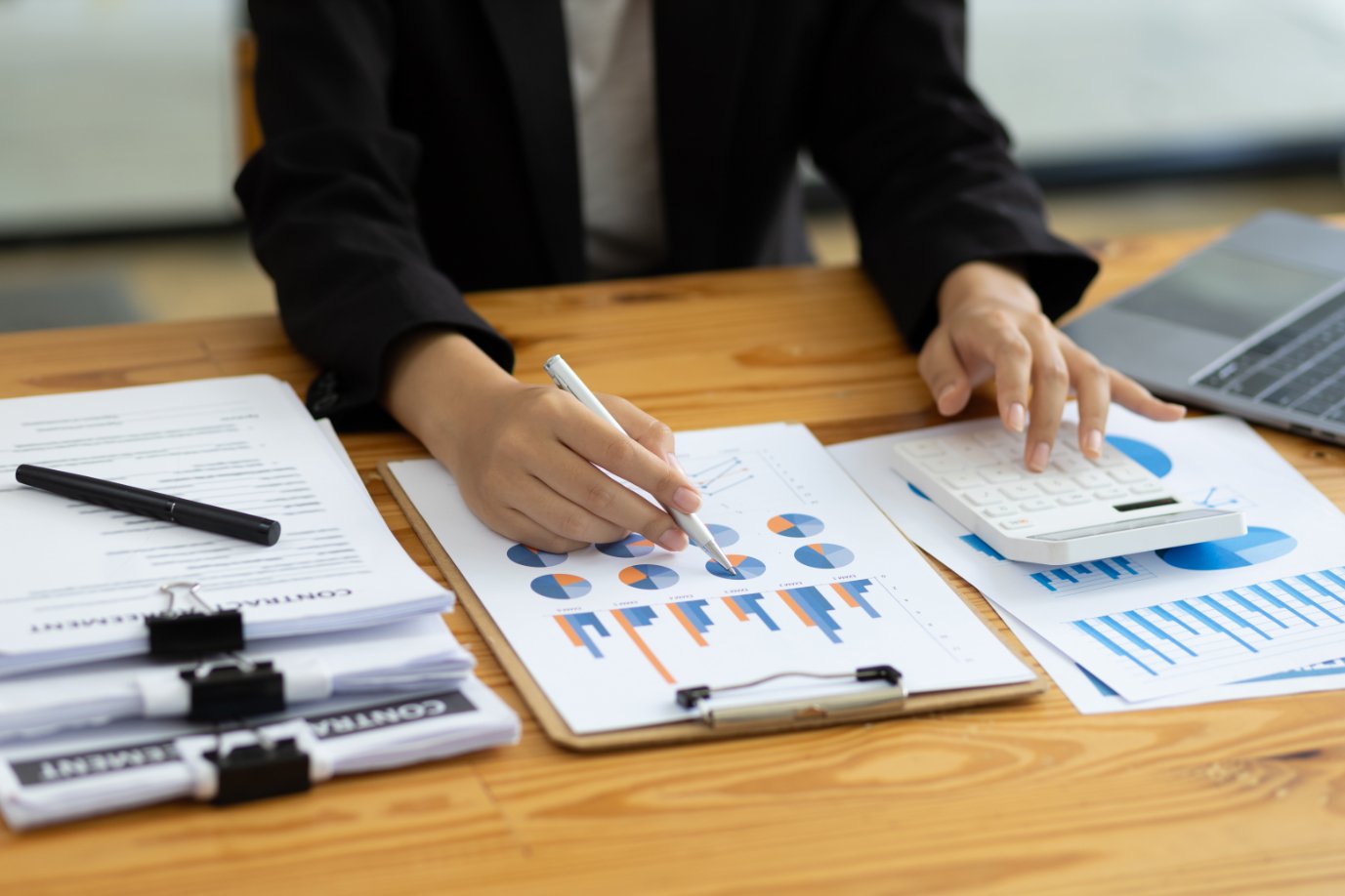 Businesswoman Working On Document On Business Char 83BKLP3 1
