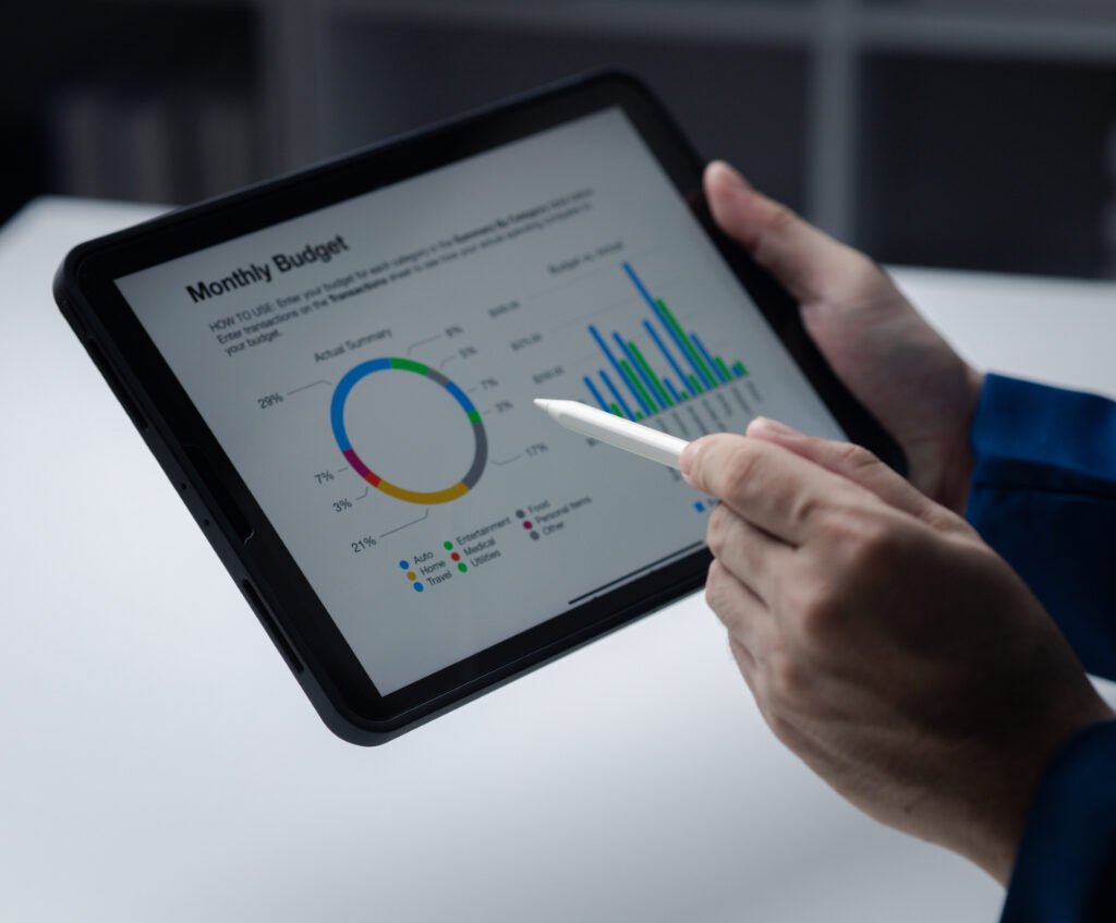 Budgeting Tips for First-Time Entrepreneurs Person Looking At Data On Tablet Businessman Owner CX6LMMD 1 1024x847