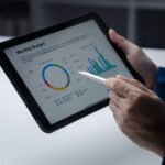 Person Looking At Data On Tablet Businessman Owner CX6LMMD 1 150x150