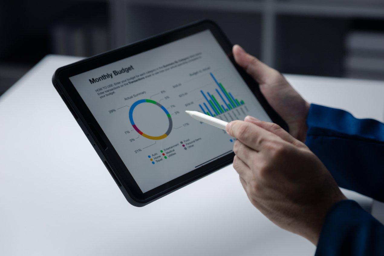 Person Looking At Data On Tablet Businessman Owner CX6LMMD 1