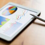 Tablet Computer And Financial Chart MTH6YBC 1 150x150